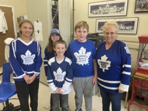 Staff and students wearing Maple Leaf Jerseys for Spirit Days