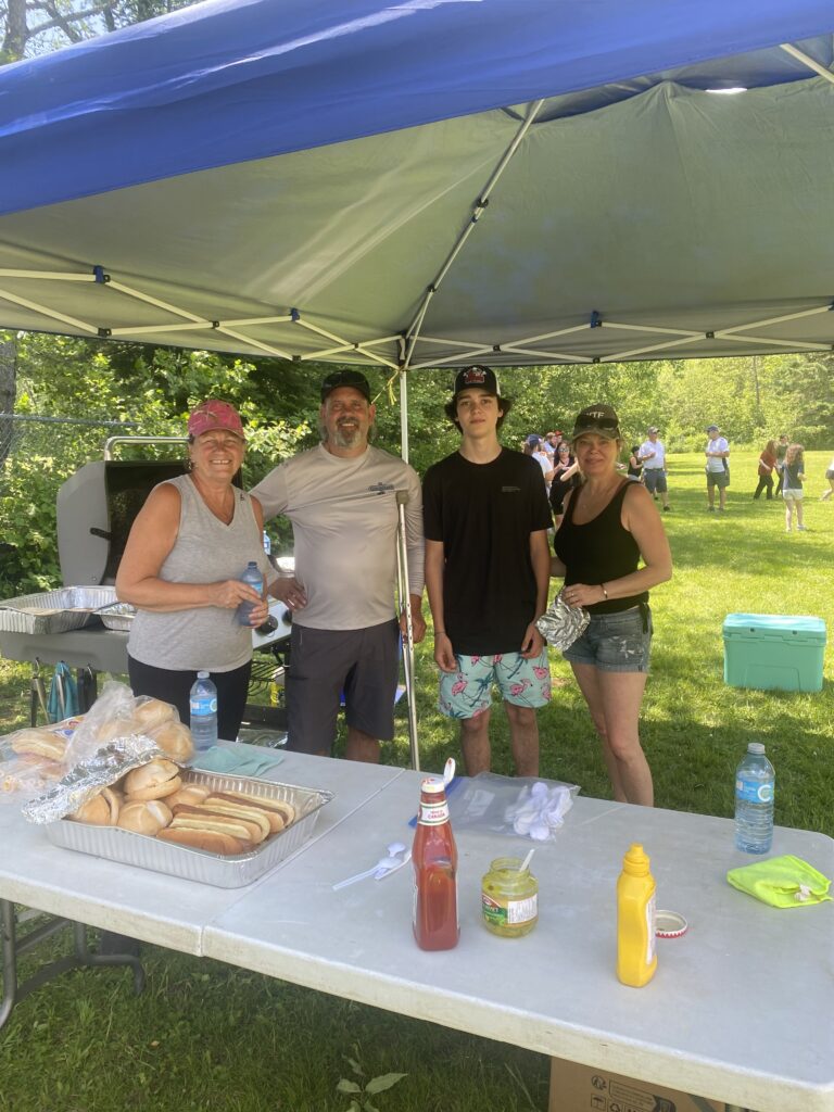 People standing at barbeque